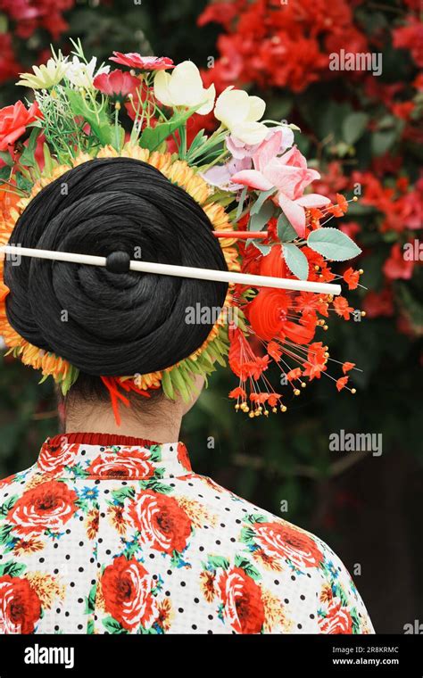 A female with an ornamental hairstyle and a floral headdress in traditional Chinese style Stock ...