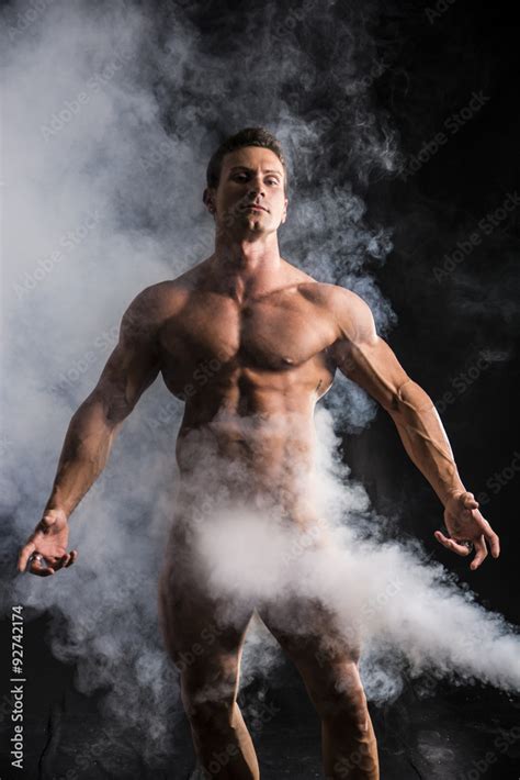 Totally Naked Male Bodybuilder With Smoke Hiding Genitalia Stock Photo