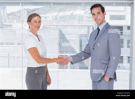 Two Colleagues Shaking Hands Stock Photo Alamy