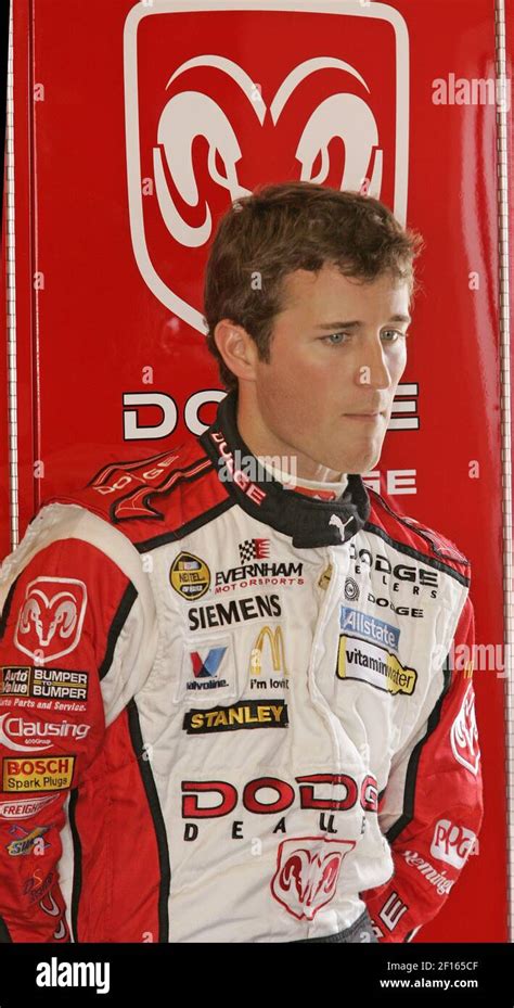 NASCAR Driver Kasey Kahne Waits With His Crew In The Garage At The