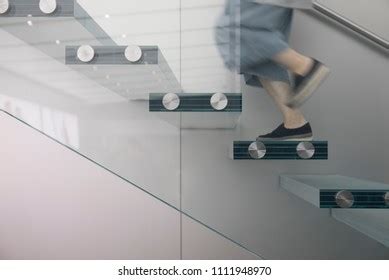 People Stepping On Glass Stairs Stock Photo 1111949000 | Shutterstock