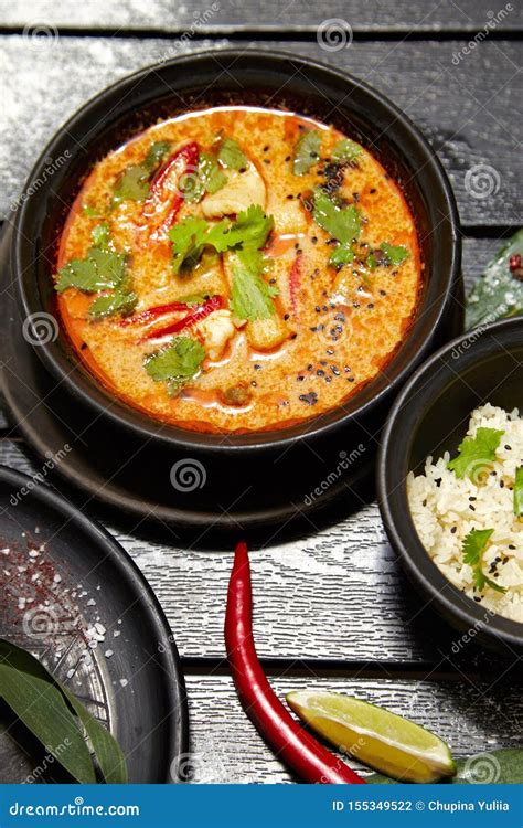 Asian Dish On A Black Plate Tom Yum With Rice Stock Photo Image Of