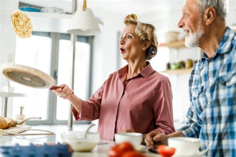 Woman Flipping Pancakes Stock Photos Pictures And Royalty Free Images