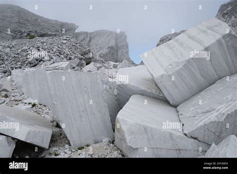 Blocks And Debris In A White Marble Quarry Shapeless Blocks In The