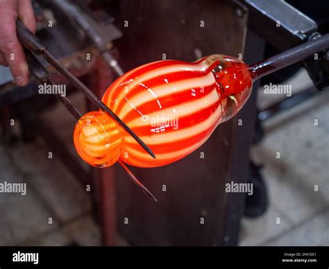 Hands Shaping Melted Glass With Long Knife Jack Art And Craft Worker Molding Glass While