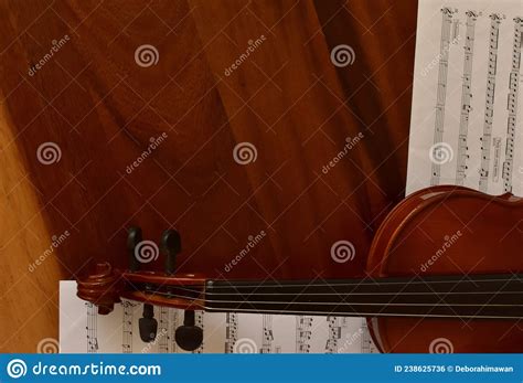 Sheet Music And Violin On Wooden Table Top View Classical Musical