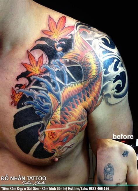 A Man With A Tattoo On His Chest Has A Koi Fish And Flowers On It