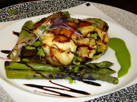 Grilled Alaskan Cod over grilled vegetables, balsamic glaze & pesto ...