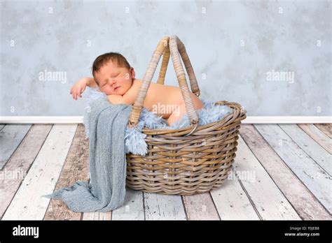 Adorable Seven Days Old Newborn Baby Boy In A Wicker Basket Stock Photo