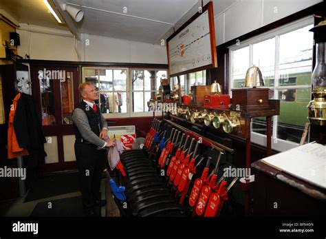 The Signalman At Work Inside The Signal Box At The Bluebell Railway At