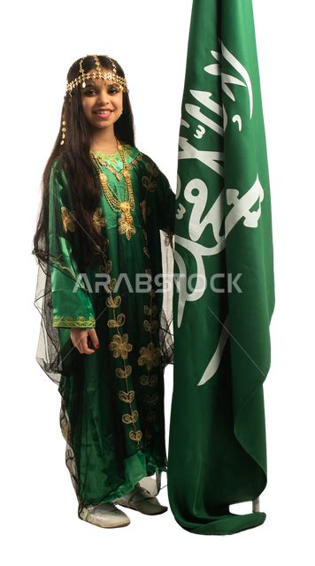 Portrait Of A Saudi Arab Gulf Girl Carrying The Saudi Flag Wearing