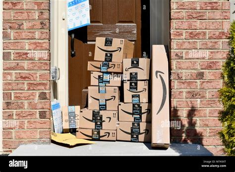 Amazon Prime boxes delivered and stacked at the front door of a ...
