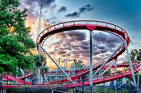 Crazy Rollercoaster Rides At Amusement Park Photograph by Alex ...