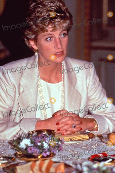 The Princess Of Wales Sitting At A Table