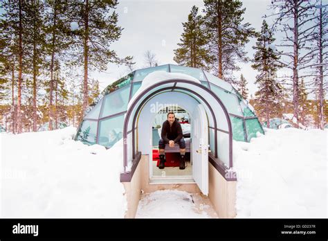 Man sitting inside igloo, Kakslauttanen Igloo Village, Saariselka, Finland, Scandinavia, Europe ...