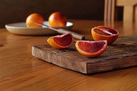 Premium Photo Sliced And Whole Ripe Juicy Sicilian Blood Oranges On