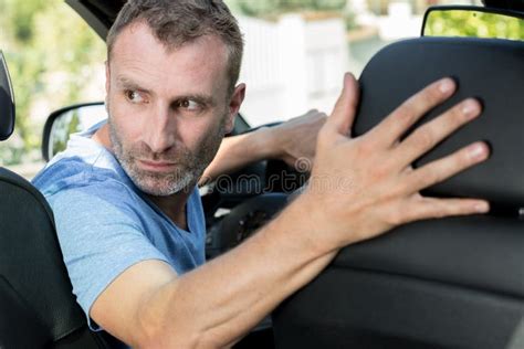 Man In Car Looking Over Shoulder Stock Image Image Of Transport