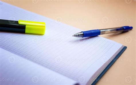 Highlighter And Pen Lying On A Notepad And Ready To Work Stock