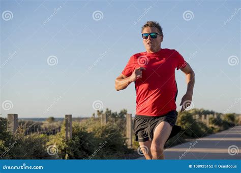 Young Attractive And Happy Sport Runner Man With Fit And Strong Healthy