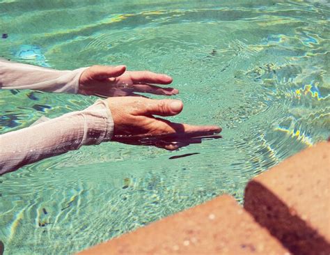 Premium Photo Cropped Hands Of Woman In Swimming Pool