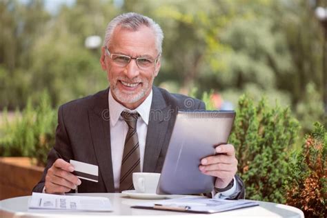 Cheerful Senior Man Sitting At The Table Stock Image Image Of Grey