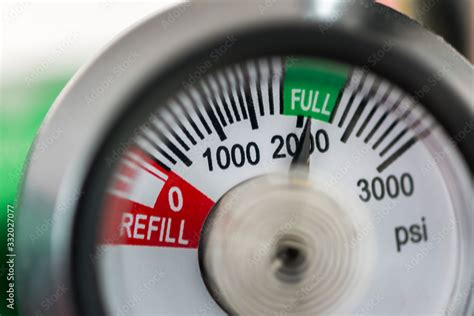 Detail Of An Oxygen Pressure Gauge And Cylinder With White Background