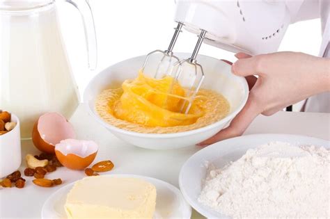 Premium Photo Female Hands Mixing Eggs In Bowl Isolated On White