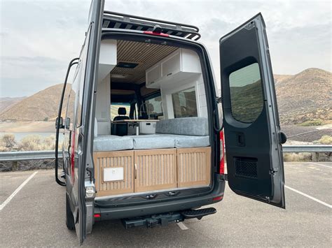 Couple Converts Sprinter Van Into A Functional Mini Beach House On