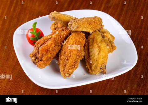 Chicken Wings Heap Served Cherry Tomato Stock Photo Alamy