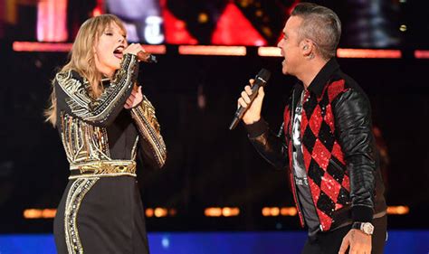 Taylor Swift surprises London Wembley Stadium with Robbie Williams on ...