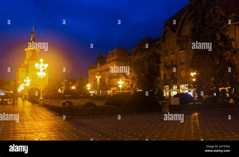 Night View Of Victoriei Square On Background With Romanian Orthodox