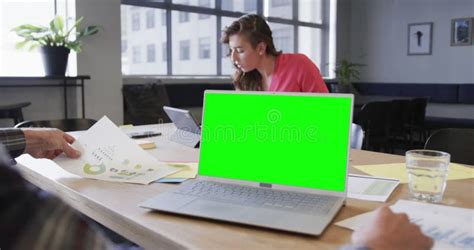 Opened Laptop With Green Screen On Desk In Office Stock Video Video