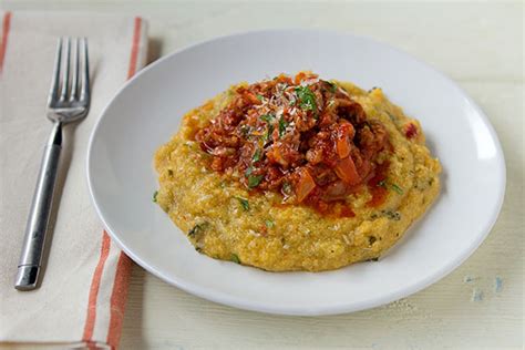 Mediterranean Kale Polenta With Spicy Italian Sausage Ragu