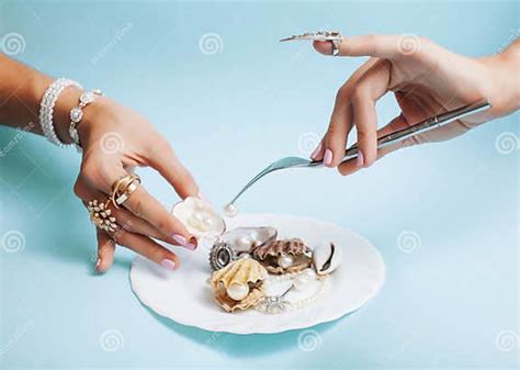 Beautiful Woman Hands With Pink Manicure Holding Plate With Pearls And