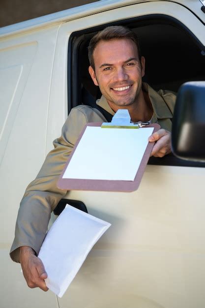 Premium Photo Smiling Delivery Man Sitting In His Van