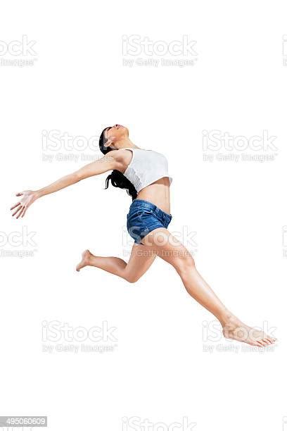 Excited Woman Jumping On White Background Stock Photo Download Image