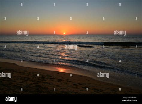 Sunset on Negombo beach Stock Photo - Alamy