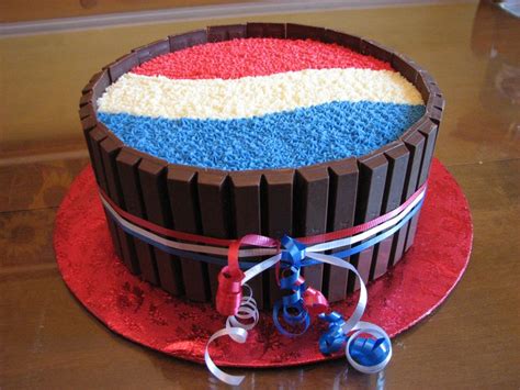 A Cake With Red White And Blue Frosting In The Shape Of A Barrel