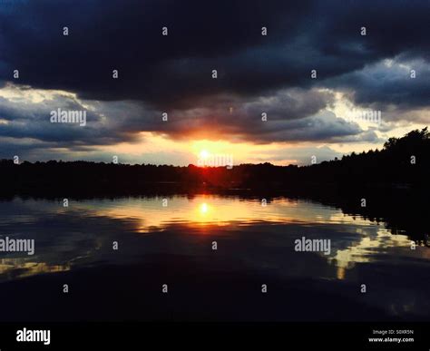 Sunset lake reflection Stock Photo - Alamy