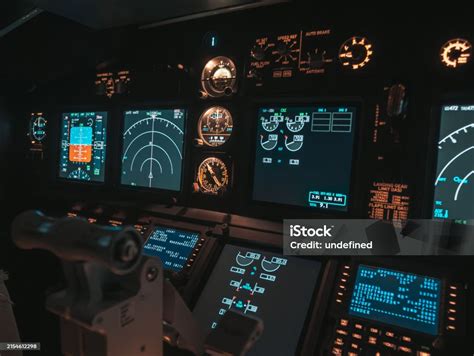 Cockpit View Of An Airplane During A Nighttime Flight With Illuminated Instrument Panels Stock ...