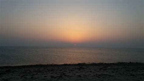 Body Of Water During Sunset Photo Free Dalma Island Abu Dhabi