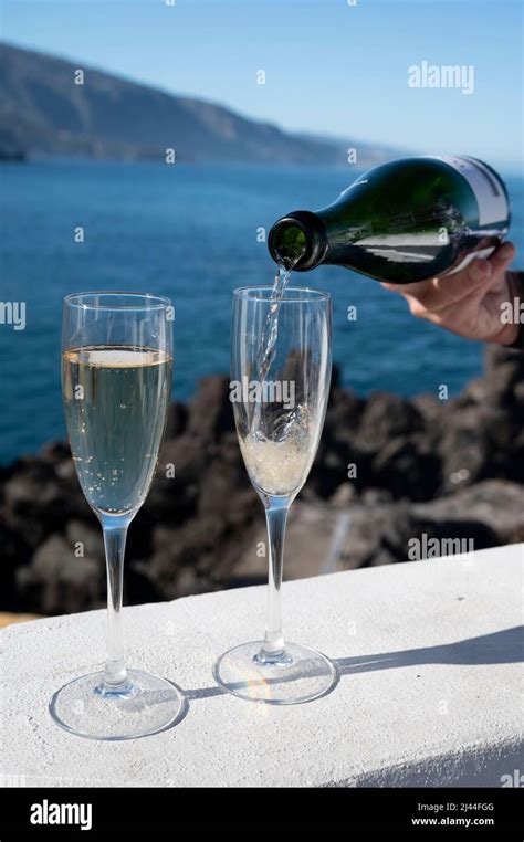 New Year Celebration With Two Glasses Of Champagne Or Spanish Cava Sparkling Wine And View On