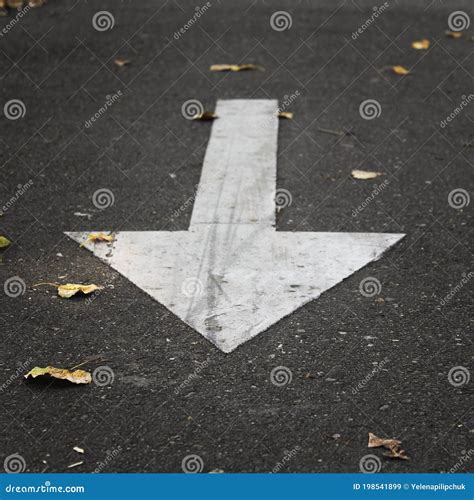 White Arrow on Black Asphalt. Road Sign Stock Image - Image of marking ...