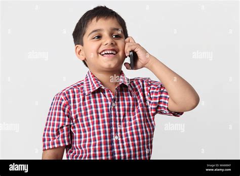 Boy Mobile Phone Talking Smiling Hi Res Stock Photography And Images