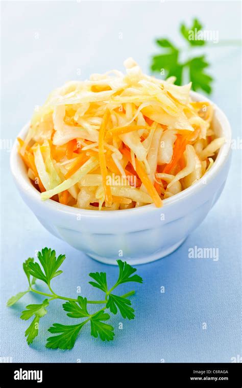 Bowl of fresh coleslaw with shredded cabbage Stock Photo - Alamy