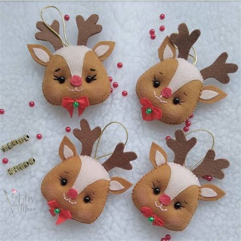 Four Christmas Ornaments With Reindeer Heads And Bows On Them