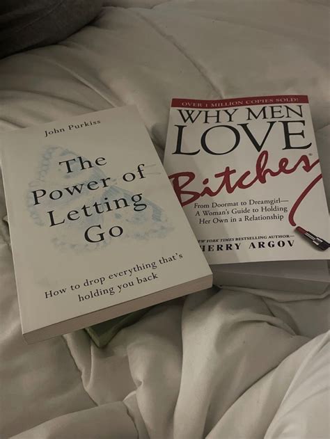 Two Books Sitting On Top Of A Bed Next To Each Other In Front Of The Covers