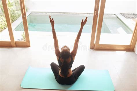 Yoga Meditation Back View Of Woman Practices Yoga In Easy Position