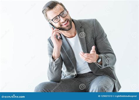 Happy Bearded Businessman In Gray Suit Gesturing And Talking On