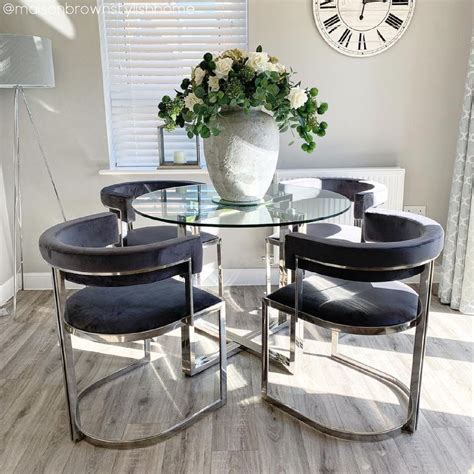 Round Glass Dining Table With Grey Velvet Cantilever Dining Chairs